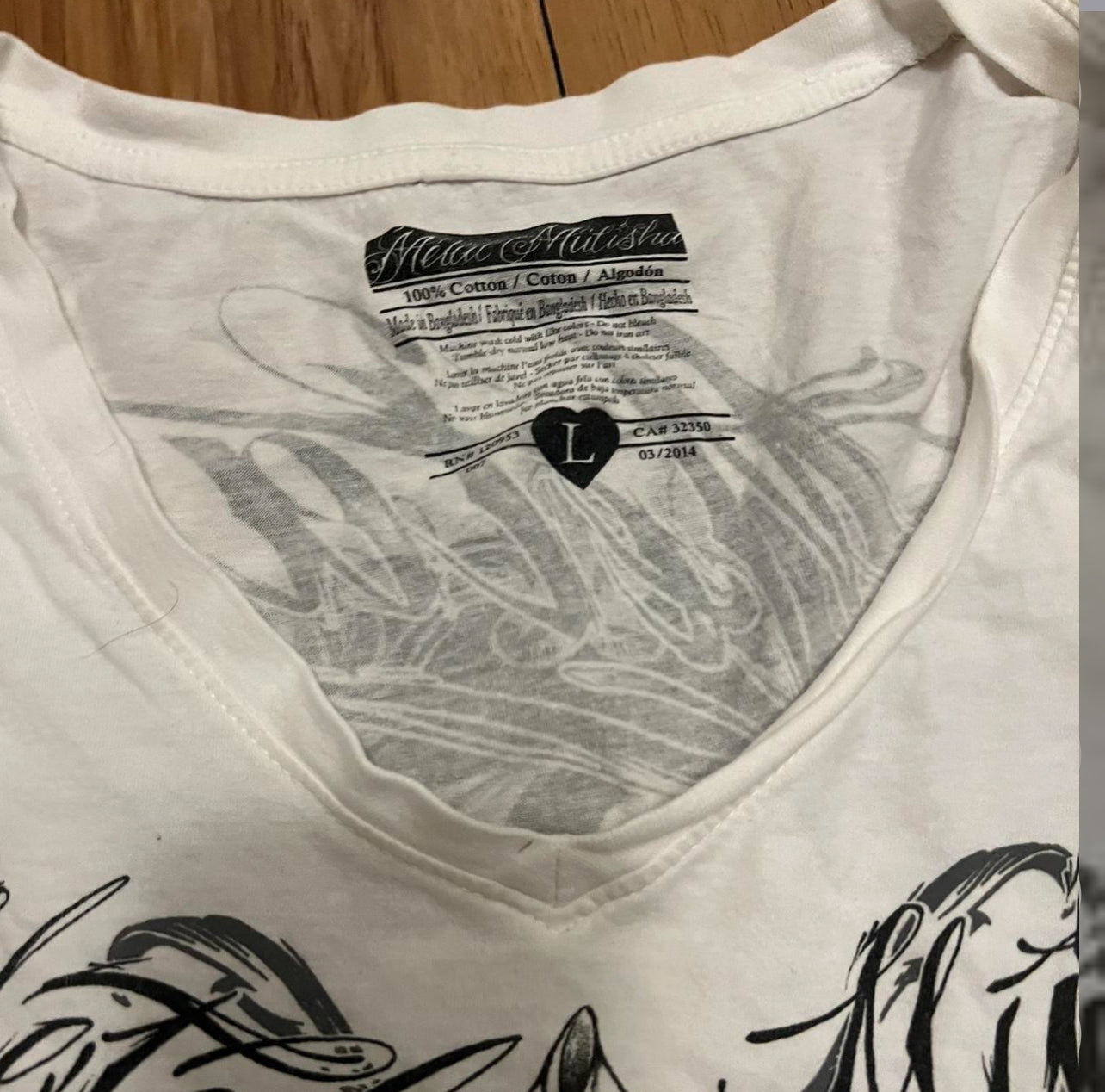 White black metal mulish skull baby tee tagged large fits medium