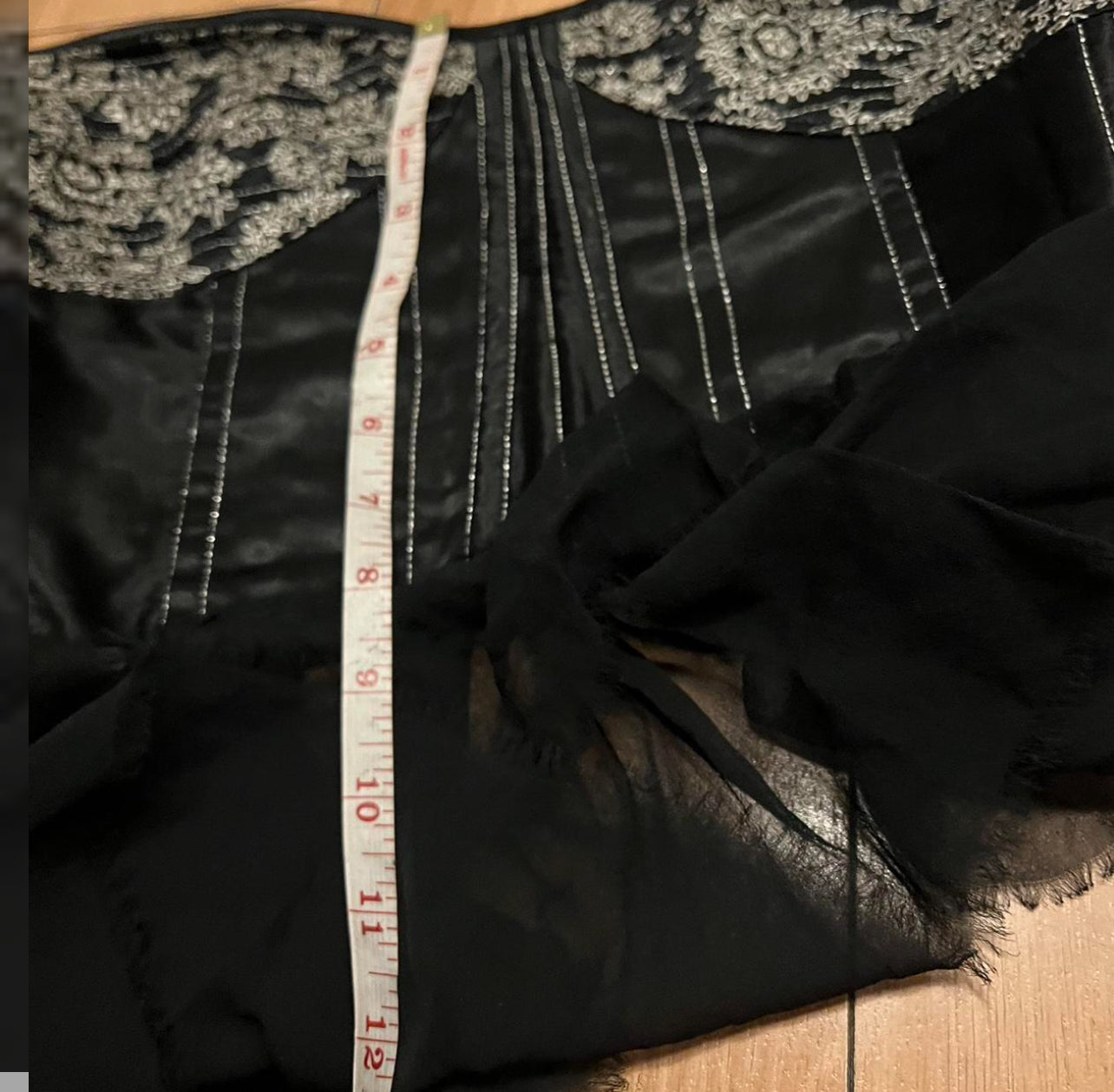 Black embroidered corset top missing lace
