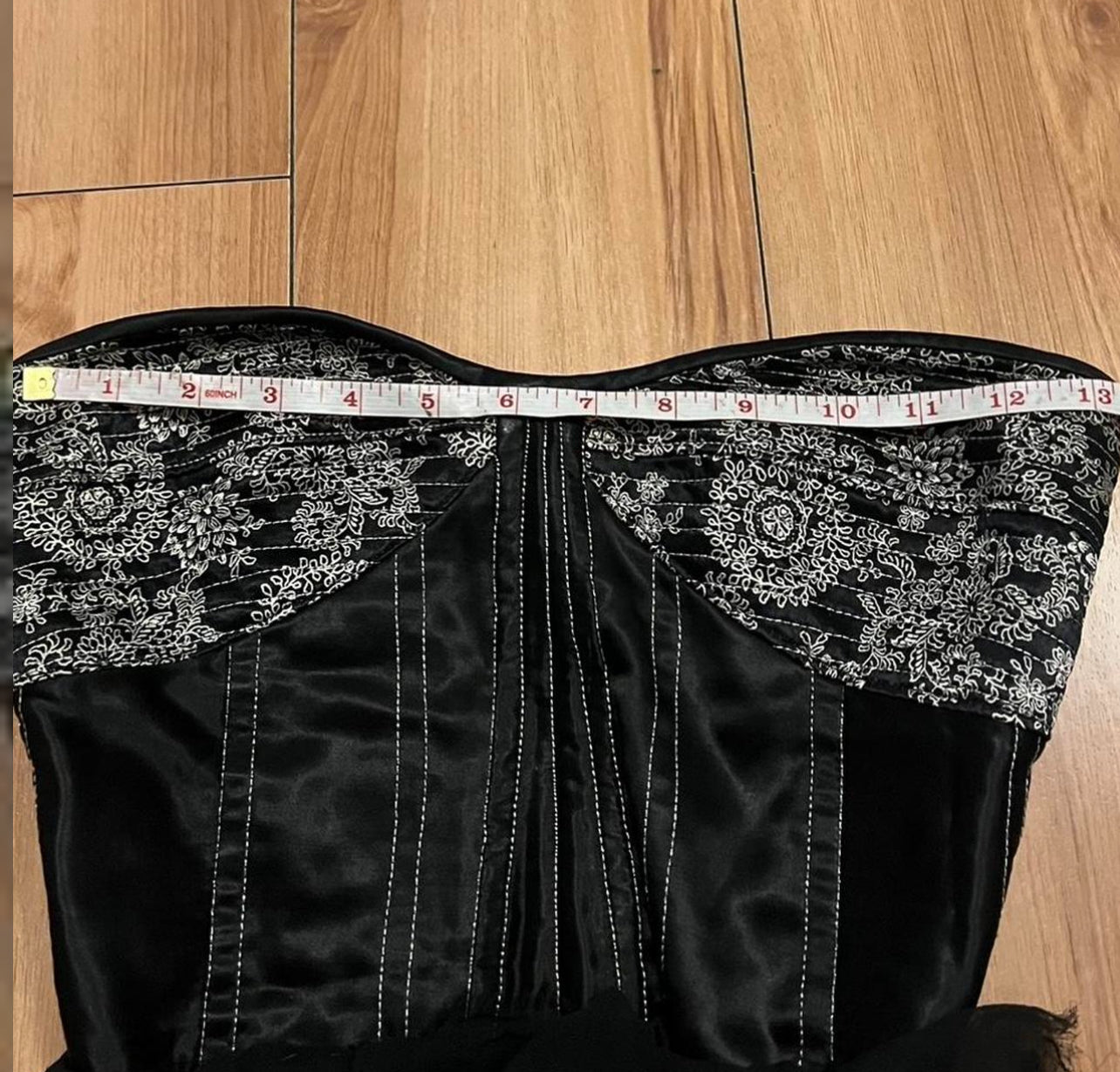 Black embroidered corset top missing lace