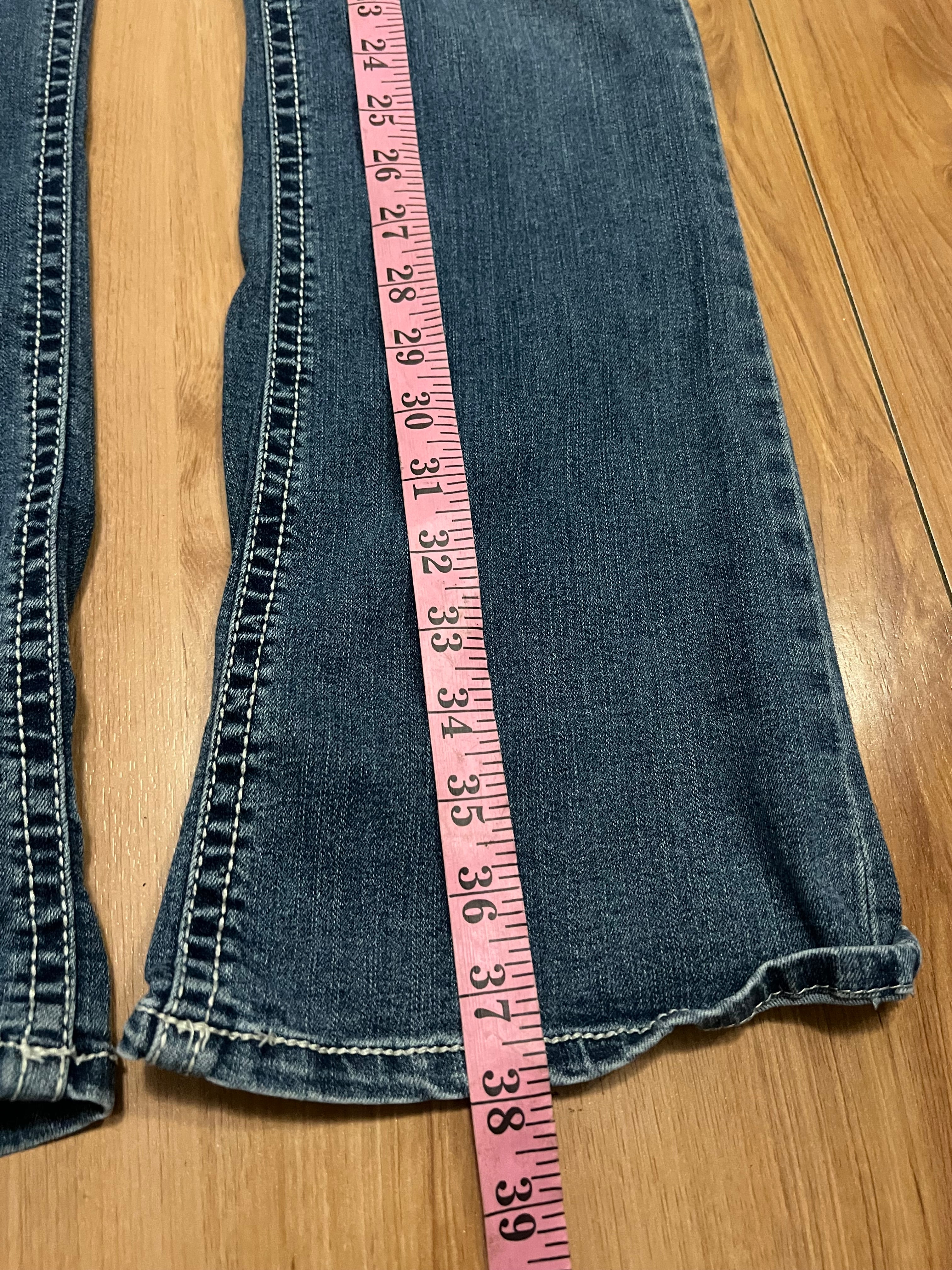 Embroidered low rise flare jeans with contrast size 8